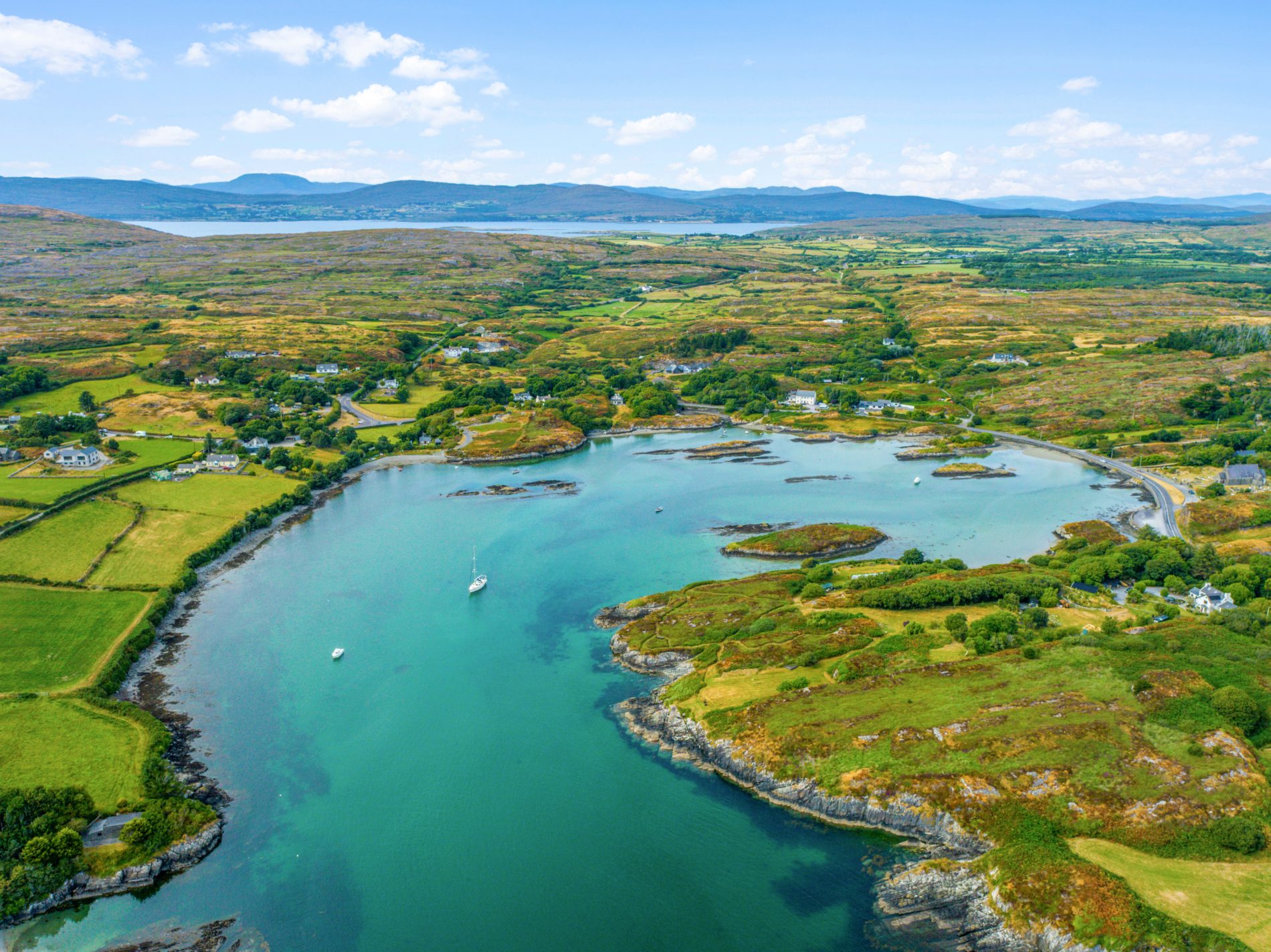 Wide aerial view of Toormore Cove and the surrounding West Cork landscape