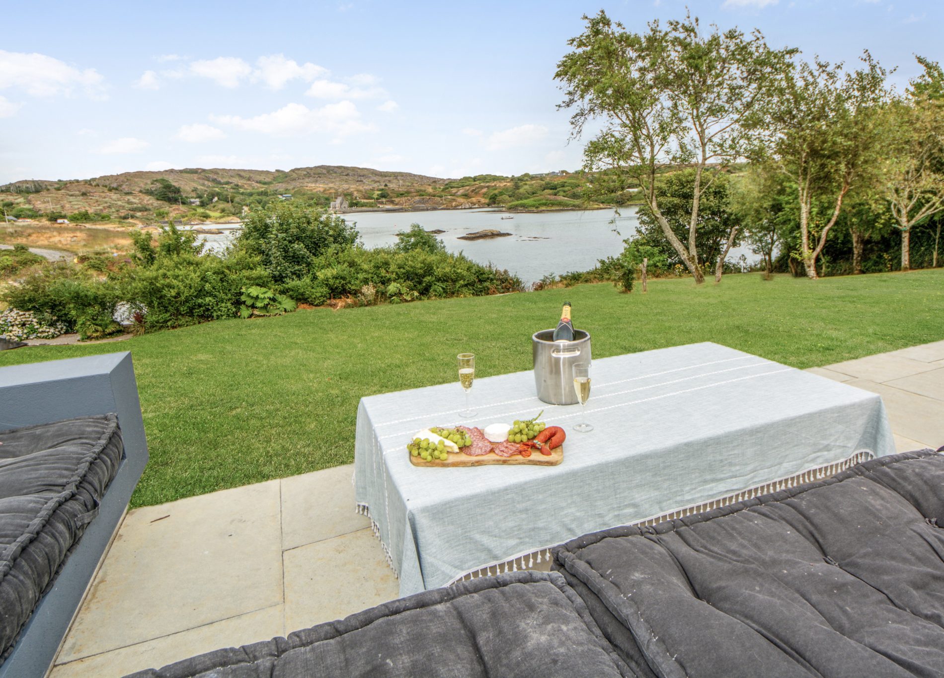 Outdoor seating and table overlooking the water